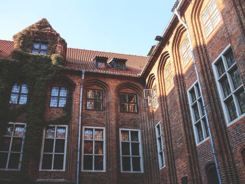 An old brick building or school in the UK. Become a partner school with Oxford International's school immersion programme